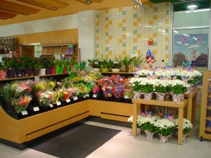 Custom laminate low-profile floral display case with pull-out shelf